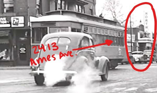 Vintage image of a car and streetcar driving past the North Star Theater